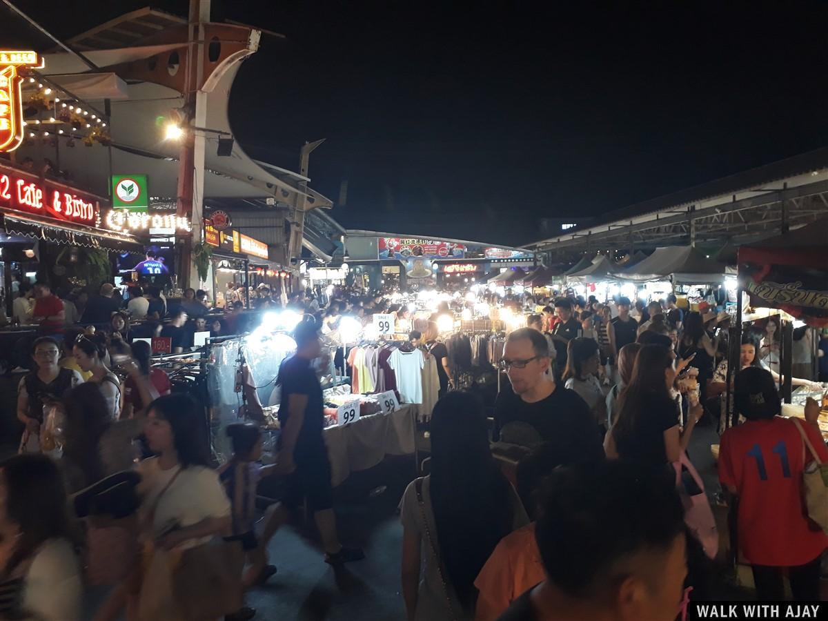 Busy street full with people at train night market