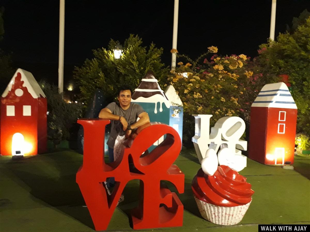 Picture taken with LOVE sign outside Chocolate Ville