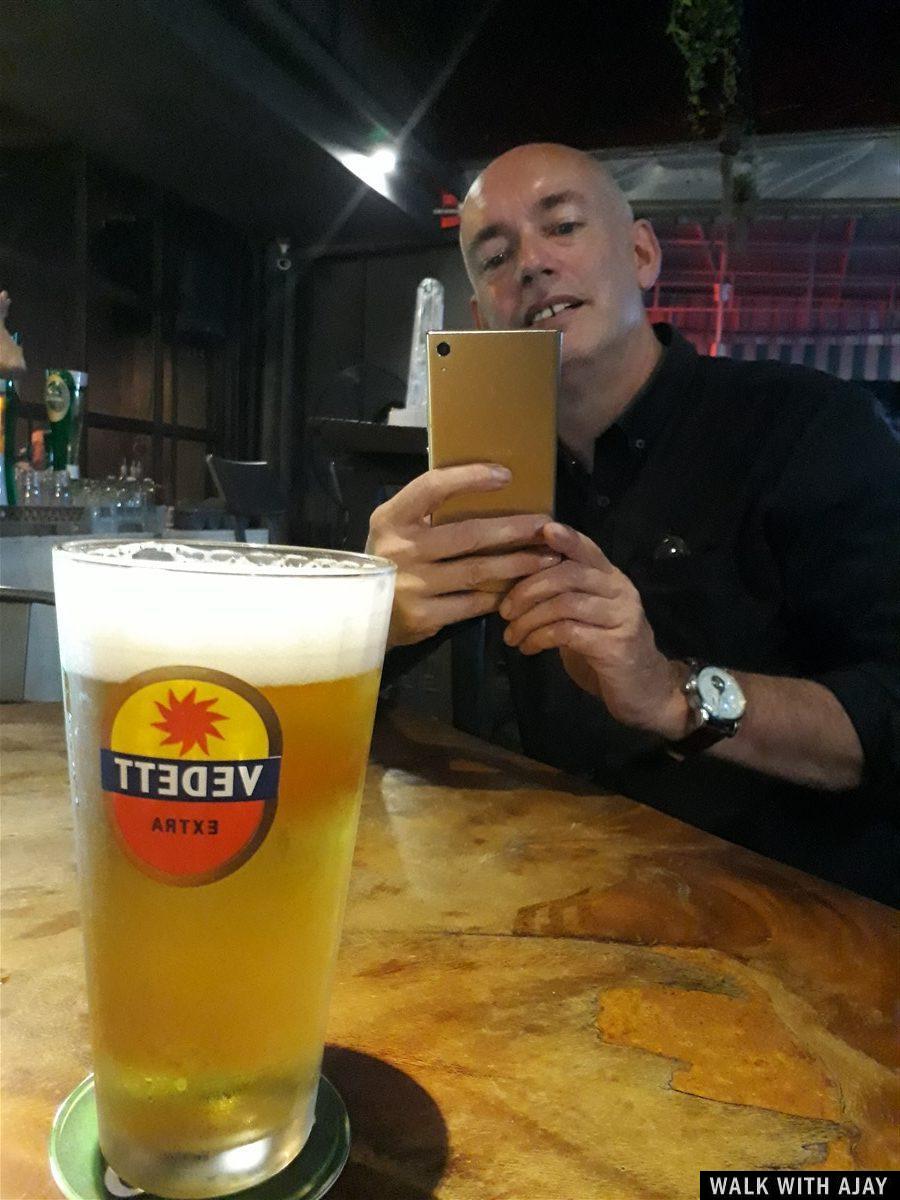 My friend taking selfie and enjoying beer.