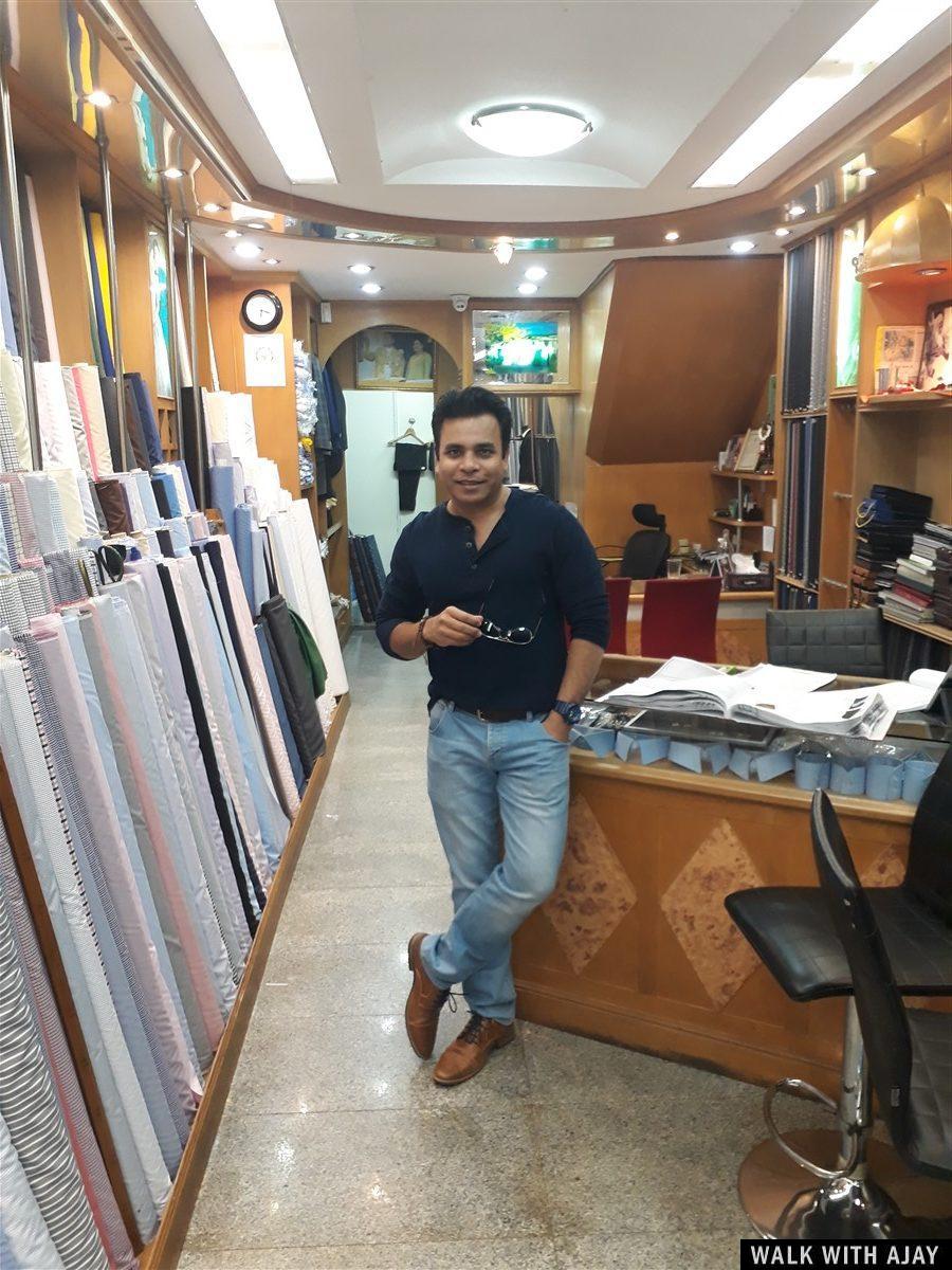 Giving pose for a click inside the shop near counter